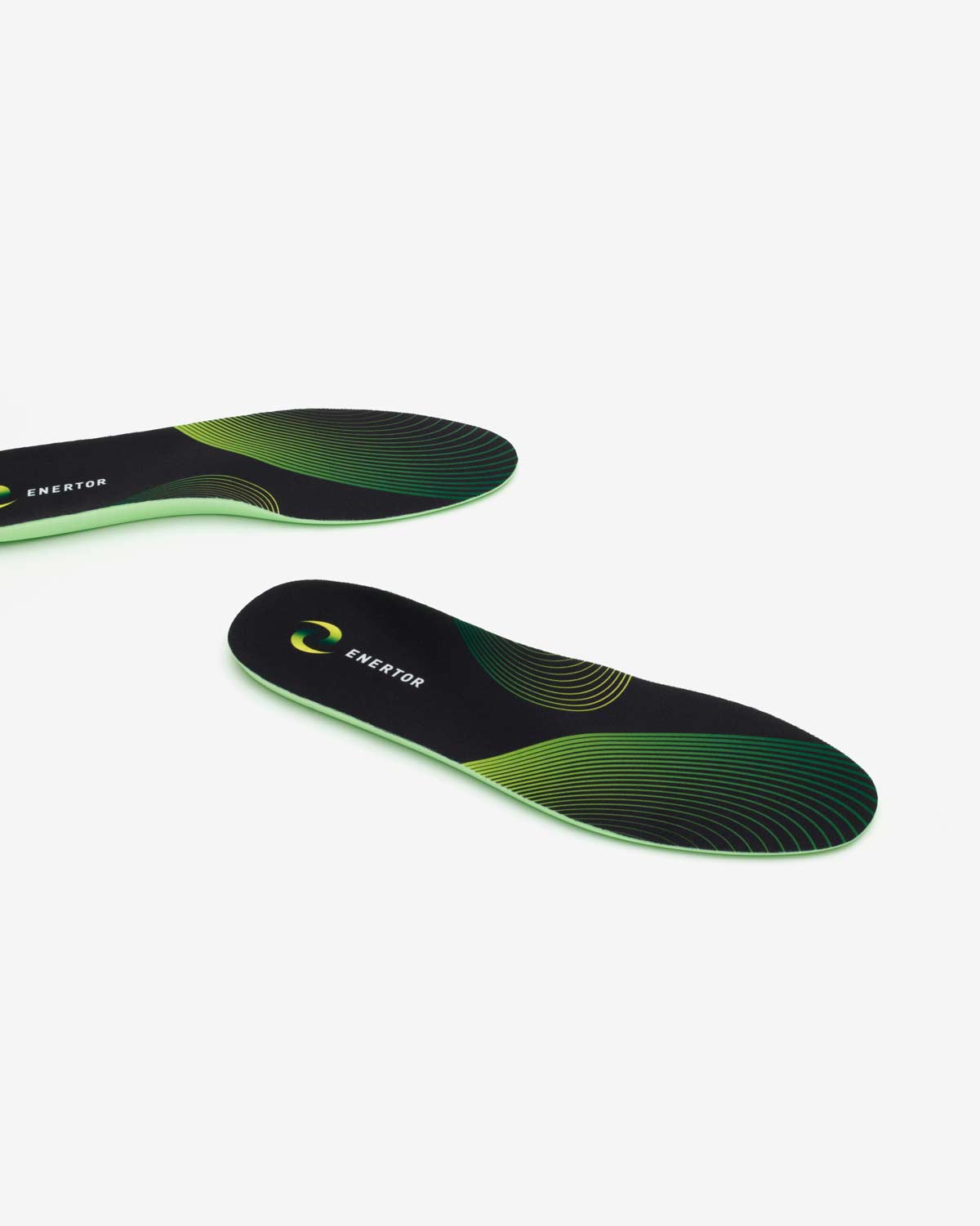 Green and black shoe insole with 'Exertor' branding on a white background