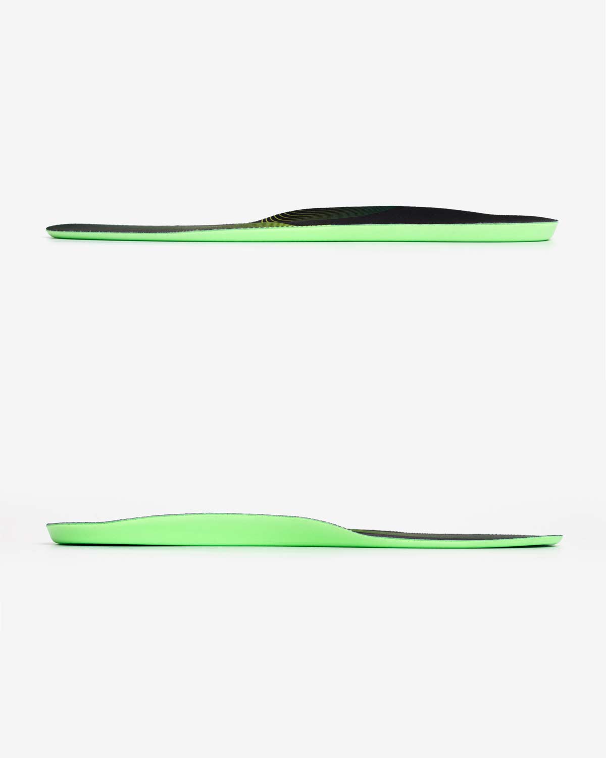 Two green and black insoles on a white background
