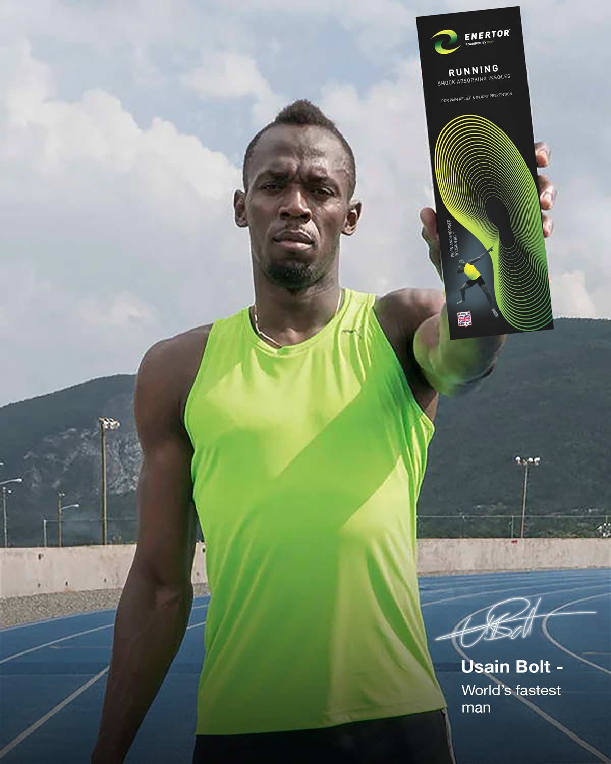 Athlete holding a running shoe box with mountains in the background