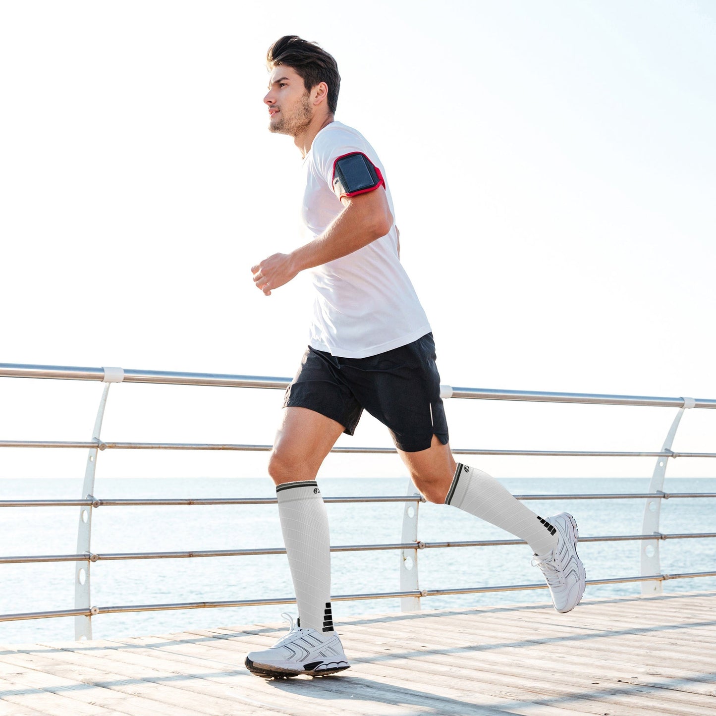 Man running on a wooden deck with a white background